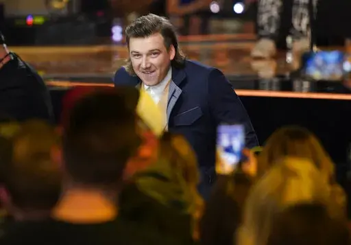 Morgan Wallen accepts the award for album of the year for "Dangerous: The Double Album" at the 57th Academy of Country Music Awards on Monday, March 7, 2022, at Allegiant Stadium in Las Vegas. (AP Photo/John Locher)