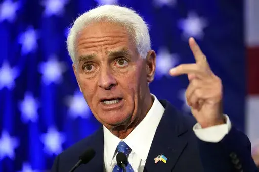 Rep Charlie Crist, D-Fla., gestures after declaring victory Tuesday, Aug. 23, 2022, in St. Petersburg, Fla. Crist defeated Agriculture Commissioner Nikki Fried in the Democratic gubernatorial primary election and will face incumbent Republican Gov. Ron DeSantis in November. (AP Photo/Chris O'Meara)