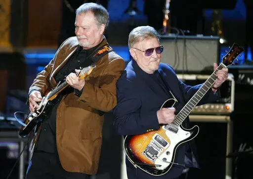 Bob Spalding, left, and Don Wilson of The Ventures perform at the Rock and Roll Hall of Fame Induction Ceremony in New York, March 10, 2008. Don Wilson, co-founder and rhythm guitarist of the instrumental guitar band The Ventures, has died. He was 88. The News Tribune reports Wilson died Saturday, Jan. 22, 2022 in Tacoma of natural causes, surrounded by his four children. (AP Photo/Jason DeCrow)