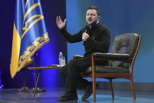Ukrainian President Volodymyr Zelenskyy answers media questions during his press conference, in Kyiv, Ukraine, Sunday, Feb. 23, 2025. (AP Photo/Evgeniy Maloletka)