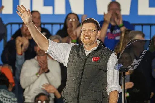 Ben Wikler, chair of the Democratic Party of Wisconsin, waves to the crowd at a campaign event, Nov. 1, 2024, in Little Chute, Wis. (AP Photo/Andy Manis, File)