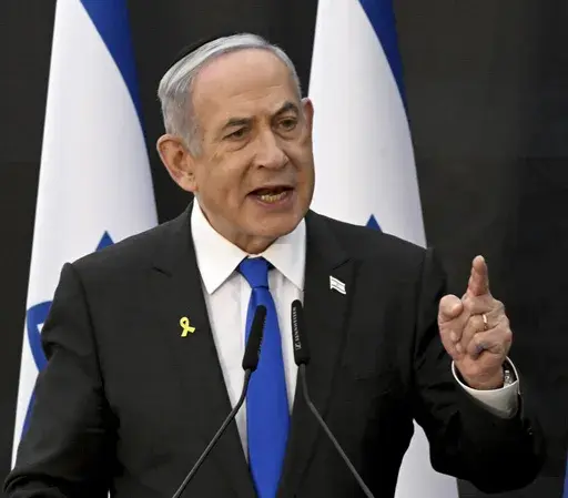 Israeli Prime Minister Benjamin Netanyahu speaks at a ceremony for the 'Remembrance Day for the Fallen of Israel's Wars and Victims of Terrorism' at Yad LeBanim in Jerusalem, Israel, Sunday, May 12, 2024. The cease-fire proposal announced by President Joe Biden has placed Prime Minister Netanyahu at a crossroads, with either path likely to shape the legacy of Israel’s longest-serving and deeply divisive leader. (Debbie Hill/Pool Photo via AP, File)