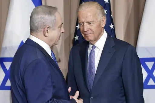 Israeli Prime Minister Benjamin Netanyahu, left, and Vice President Joe Biden talk prior to a meeting on the sidelines of the World Economic Forum in Davos, Switzerland, Jan. 21, 2016. President Joe Biden spoke Sunday, March 19, 2023, with Israeli Prime Minister Benjamin Netanyahu to “express concern” over his government’s planned overhaul of the country’s judicial system that has sparked widespread protests across Israel and to encourage compromise. (AP Photo/Michel Euler, File)