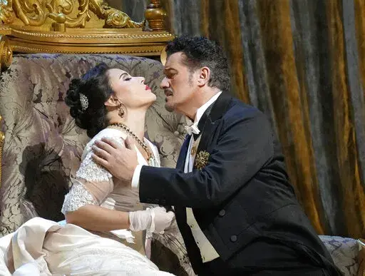 This image provided by Met Opera shows Sonya Yoncheva as Fedora, left, and Piotr Beczala as Loris Ipanoff in Giordano's "Fedora." (Ken Howard/Met Opera via AP)