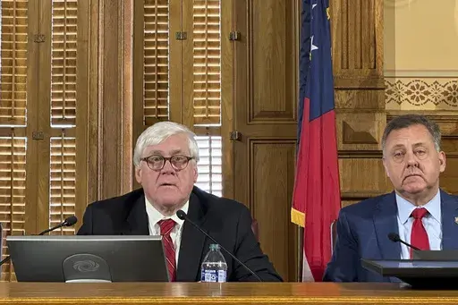 Georgia state Sen. Bill Cowsert, R-Athens, left, speaks, Friday, Feb. 9, 2024, at the Georgia Capitol in Atlanta, during the first meeting of a state Senate committee to investigate Fulton County District Attorney Fani Willis. Cowsert says an inquiry into whether Willis committed misconduct won't be a partisan "witch hunt," but minority Democrats say they doubt the inquiry's good faith. (AP Photo/Jeff Amy)