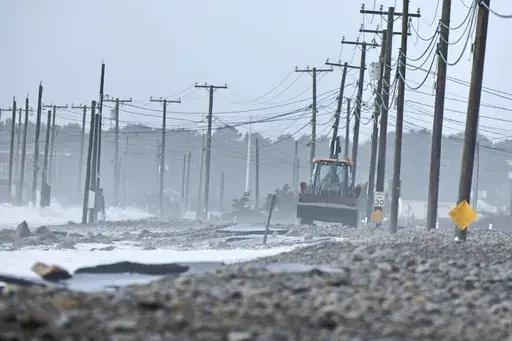 The remnants of East Beach Road are damaged after heavy overnight winds and surf battered the coastline, Wednesday, Jan. 10, 2024 in Westport, Mass. Salisbury, Mass., is scrambling after a weekend storm washed away mountains of sand trucked in for nearly $600,000 dune that was meant to protect homes, roads and other infrastructure. The community and other areas of Massachusetts also were hit by severe storms in January, including flooding, erosion, and infrastructure damage. (Peter Pereira/The S