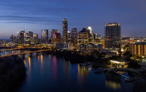 Lights from inside buildings illuminate the skyline, Monday, Feb. 5, 2018, in Austin, Texas. Some of the largest U.S. cities challenging their 2020 census numbers aren't getting the results they hoped for from the U.S. Census Bureau. (Jay Janner/Austin American-Statesman via AP, File)