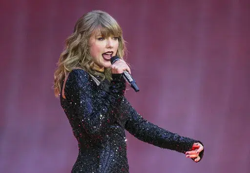 Singer Taylor Swift performs on stage in a concert at Wembley Stadium on June 22, 2018, in London. On the heels of a messy ticket roll out for Swift’s first tour in years, fans are angry; they’re also energized against Ticketmaster. While researchers agree that there’s no way to tell how long the energy could last, the outrage shows a way for young people to become more politically engaged through fan culture. (Photo by Joel C Ryan/Invision/AP, File)