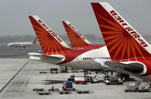 Air India aircrafts stand at Indira Gandhi International Airport in New Delhi, India, April 29, 2011. An Air India plane flying from New Delhi to San Francisco landed in Russia after it developed an engine problem, officials said on Wednesday, June 7, 2023. The plane, carrying 216 passengers and 16 crew members, landed safely at Russia’s Magadan airport in the country’s far east on Tuesday, Air India said in a statement. (AP Photo/Kevin Frayer, File)