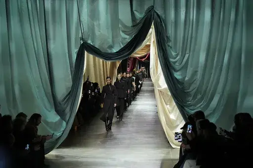 Models wear creations during the Fendi women's Fall-Winter 2024-25 collection presented in Milan, northern Italy, Wednesday, Feb. 21, 2024. (AP Photo/Antonio Calanni)