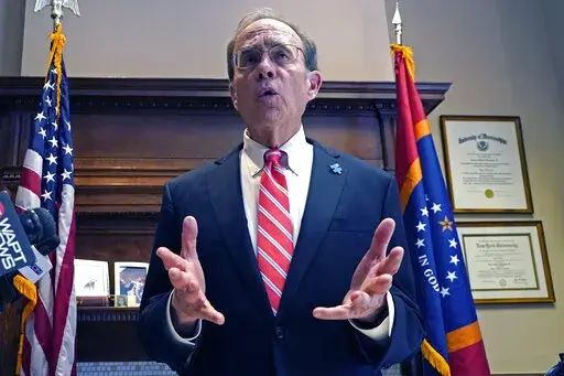 Mississippi Lt. Gov. Delbert Hosemann tells reporters Monday, March 14, 2022, that he and other state Senate leaders propose a six-month suspension of the state's gasoline tax to give drivers a break amid rising gas prices, during a news conference at the Mississippi Capitol in Jackson. The tax is 18.4 cents per gallon, and money from it goes to the state Department of Transportation. The proposal would have to be approved by the House, the Senate and Republican Gov. Tate Reeves. (AP Photo/Rogel