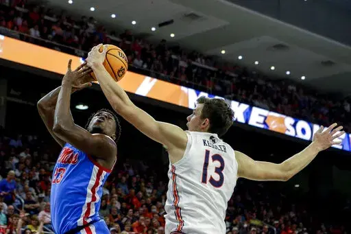 Auburn forward Walker Kessler (13) blocks a shot attempt by Mississippi forward Sammy Hunter (23) during the first half of an NCAA college basketball game Wednesday, Feb. 23, 2022, in Auburn, Ala. (AP Photo/Butch Dill)