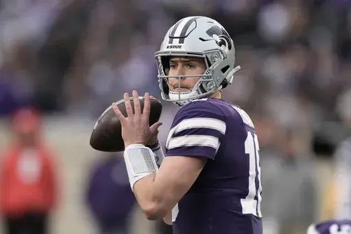 Then-0Kansas State quarterback Will Howard looks to pass during the second half of the team's NCAA college football game against Baylor, Nov. 11, 2023, in Manhattan, Kan. (AP Photo/Charlie Riedel, File)