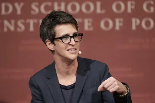 MSNBC television anchor Rachel Maddow, host of "The Rachel Maddow Show," moderates a panel at the John F. Kennedy School of Government, at Harvard University, in Cambridge, Mass., on Oct. 16, 2017. Maddow's "Deja News," a podcast she's made with longtime producer Isaac-Davy Aronson that looks at historical incidents that can teach us lessons about current events. (AP Photo/Steven Senne, File)