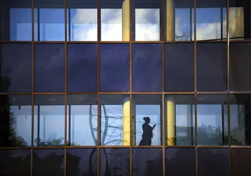A woman walks inside a hallway on Monday, Aug. 6, 2018, at Commonwealth Health Moses Taylor Hospital in Scranton, Pa.  There are several things that can prevent you from getting therapy or other mental health treatment. A social stigma against needing that kind of help is a big one, as is the inability to take time out of the workday for appointments. But for many, the biggest blocker of all is the cost. You might not find a lot of therapists in your area that take your insurance, and even if yo
