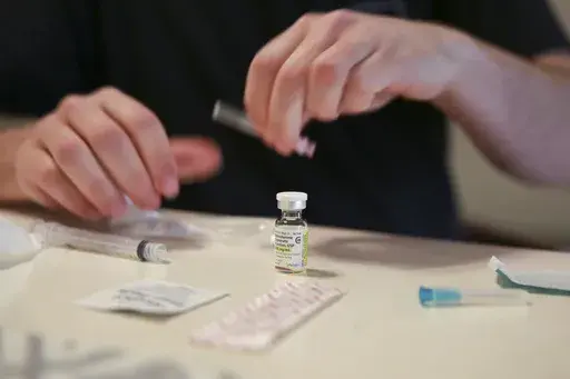 Lucas prepares his weekly testosterone shot at his home in Casselberry, Fla., May 29, 2023. The Associated Press is not using Lucas' last names because he fears reprisal. (AP Photo/Laura Bargfeld, File)