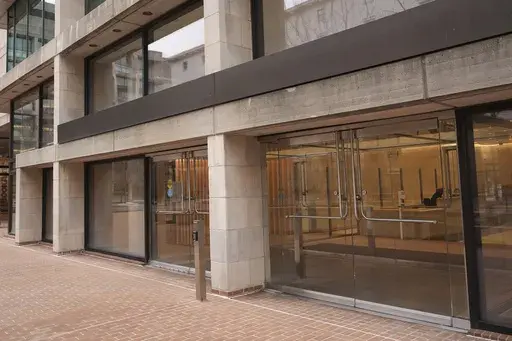 The building for the Consumer Financial Protection Bureau headquarters building is empty of CFPB signage as seen Friday, March 14, 2025, in Washington. (AP Photo/Jacquelyn Martin)
