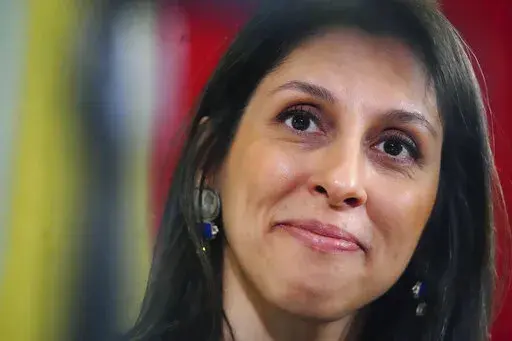 Nazanin Zaghari-Ratcliffe smiles during a press conference hosted by her local MP Tulip Siddiq, in the Macmillan Room, Portcullis House, following her release from detention in Iran, in London, Monday March 21, 2022. (Victoria Jones/Pool Photo via AP)