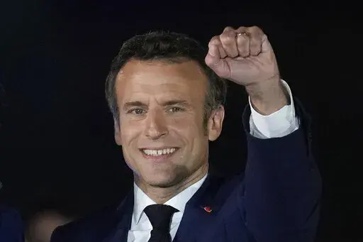 French President Emmanuel Macron celebrates with his supporters in Paris, France, Sunday, April 24, 2022. French President Emmanuel Macron's reelection has bolstered his standing as a senior player in Europe. Macron is now expected to push for strengthening the 27-nation bloc and throw all his weight behind efforts to end the war in Ukraine. (AP Photo/Christophe Ena, File)