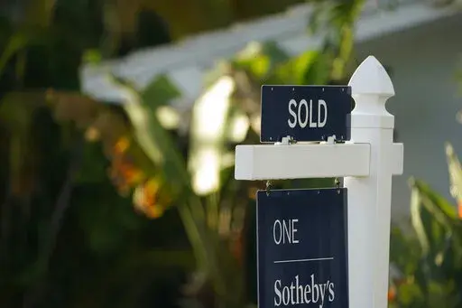 A sold sign is shown in front of a home, Monday, Sept. 20, 2021, in Surfside, Fla.  Average long-term U.S. mortgage rates rose this week as the key 30-year loan vaulted over 4% for the first time since May 2019. Mortgage buyer Freddie Mac reports, Thursday, March 17, 2022,  that the average rate on the 30-year loan this week jumped to 4.16% from 3.85% last week.   (AP Photo/Wilfredo Lee)