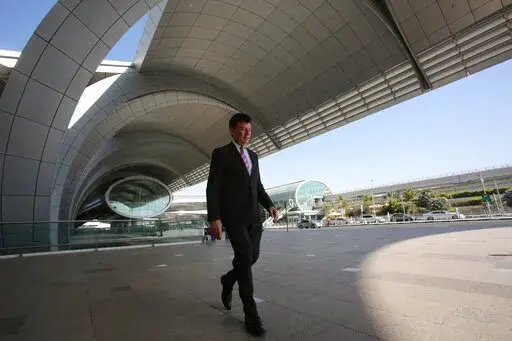 Dubai Airports CEO Paul Griffiths walks out of the Dubai International Airport's Terminal 3 in Dubai, United Arab Emirates, June 17, 2014. Dubai International Airport, the world's busiest for international travel, announced on Thursday it handled over 13.6 million passengers in the first three months of 2022 — more than double last year's number in a clear sign that a long-awaited travel revival has come to the global aviation hub. (AP Photo/Kamran Jebreili, File)
