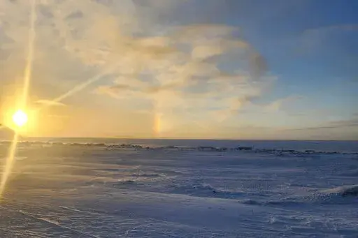 The view from the front of the school in in Wales, Alaska, where a 24-year-old woman and her 1-year-old son were killed in an encounter with a polar bear on Tuesday, Jan. 17, 2023, is seen in this photo taken on Sunday, Jan. 15, 2023, by Chrissy Friberg, a traveling optician who was providing services in the village. (Chrissy Friberg via AP)