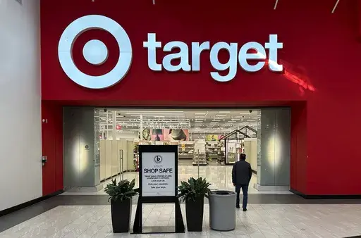 A shopper heads into a Target store Jan. 11, 2024, in Lakewood, Colo. Target will no longer accept personal checks from shoppers as of July 15, underscoring how this once popular method of payment has gone the way of such archaic artifacts as the floppy disc or the rolodex. (AP Photo/David Zalubowski, File)