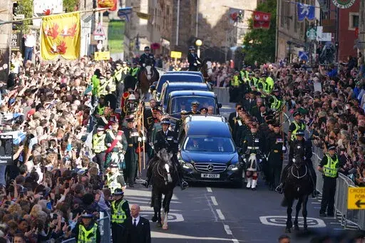 King Charles III,  Princess Anne and members of the Royal family join the procession of Queen Elizabeth II's coffin from the Palace of Holyroodhouse to St Giles' Cathedral, in Edinburgh, Monday, Sept. 12, 2022. King Charles arrived in Edinburgh on Monday to accompany his late mother’s coffin on an emotion-charged procession through the historic heart of the Scottish capital to the cathedral where it will lie for 24 hours to allow the public to pay their last respects. (Andrew Milligan/Pool Pho