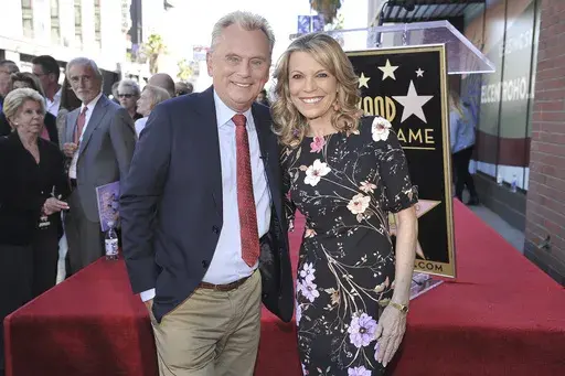Pat Sajak, left, and Vanna White, from "Wheel of Fortune," attend a ceremony honoring Harry Friedman with a star on the Hollywood Walk of Fame on Nov. 1, 2019, in Los Angeles. Sajak is taking one last spin on “Wheel of Fortune," announcing Monday, June 12, 2023, that its upcoming season will be his last as host. (Photo by Richard Shotwell/Invision/AP, File)