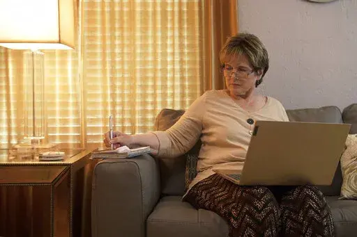 This photo provided by the Providence Cancer Institute of Oregon in May 2022 shows Kathy Wilkes of Ormond Beach, Fla. Wilkes, with advanced pancreatic cancer, saw her tumors dramatically shrink after researchers in Oregon turbocharged her own immune cells, highlighting a possible new way to someday treat a variety of cancers. (Providence Cancer Institute of Oregon via AP)