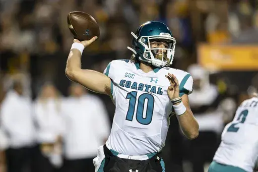 Coastal Carolina quarterback Grayson McCall (10) throws a pass during the first half of the team's NCAA college football game against Appalachian State on Oct. 20, 2021, in Boone, N.C. Coastal Carolina begins their season at UCLA on Sept. 2, 2023. (AP Photo/Matt Kelley, File)
