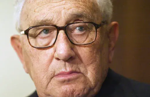 Former Secretary of State Henry Kissinger is seen during a meeting with President Vladimir Putin in the Novo-Ogaryovo residence outside Moscow, June 6, 2006. Kissinger, the diplomat with the thick glasses and gravelly voice who dominated foreign policy as the United States extricated itself from Vietnam and broke down barriers with China, died Wednesday, Nov. 29, 2023. He was 100. (AP Photo/Sergey Ponomarev, File)
