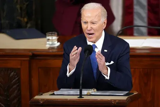 President Joe Biden delivers the State of the Union address to a joint session of Congress at the U.S. Capitol, Tuesday, Feb. 7, 2023, in Washington. Biden has sparked a firestorm after saying in his State of the Union address that the United States will need oil “for at least another decade.″ Republicans laughed at Biden’s off-the-cuff remark, which was not in his scripted speech. GOP lawmakers accuse the Democratic president of refusing to accept reality and “living in a green hallucin