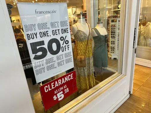 A sign trumpets discounts available in a clothing store in a mall Monday, April 29, 2024, in Lone Tree, Colo. On Wednesday, May 15, 2024, the Labor Department issues its report on inflation at the consumer level in April. (AP Photo/David Zalubowski)