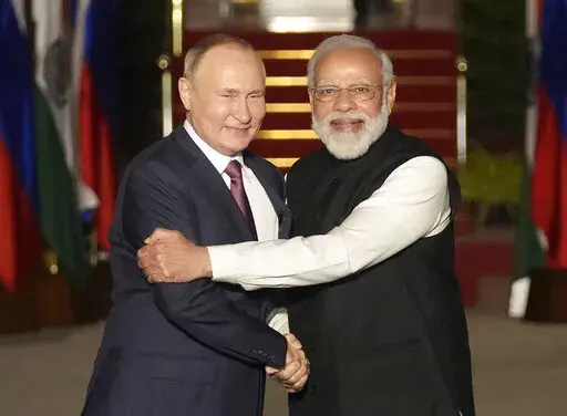 Russian President Vladimir Putin, left, and Indian Prime Minister Narendra Modi greet each other before their meeting in New Delhi, India on Dec. 6, 2021. India is bracing for a disruption in Russian arms supplies following Moscow's invasion of Ukraine, and Prime Minister Narendra Modi's tightrope walk between Moscow and Washington could become more difficult due to a border standoff with China. (AP Photo/Manish Swarup, File)