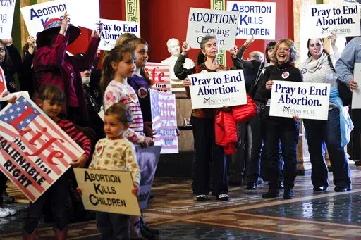 Protesters fill the Montana state Capitol rotunda in Helena, Mont., on Feb. 11, 2015, during a rally to show support in an attempt to change the Montana Constitution to define life as beginning at conception. State officials in Republican-controlled Montana want to require prior authorization before its health department pays for abortions for people covered by Medicaid, a proposal critics say would reduce access and delay or even prevent abortion care for low-income women in a state. (Thom Brid