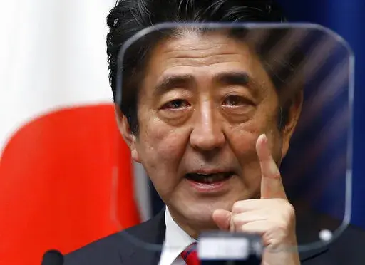 Japanese Prime Minister Shinzo Abe speaks during a press conference at his official residence in Tokyo on March 20, 2014. Former Japanese Prime Minister Abe, a divisive arch-conservative and one of his nation's most powerful and influential figures, has died after being shot during a campaign speech Friday, July 8, 2022, in western Japan, hospital officials said.(AP Photo/Shizuo Kambayash, File)