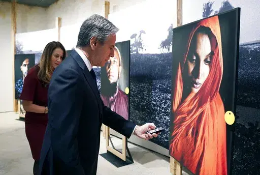 Secretary of State Antony Blinken tours the "Burma's Path To Genocide" exhibit at the United States Holocaust Memorial Museum, Monday, March 21, 2022 in Washington. Blinken says the violent repression of the largely Muslim Rohingya population in Myanmar amounts to genocide. The declaration on Monday is intended to both generate international pressure and lay the groundwork for potential legal action.  (Kevin Lamarque, Pool via AP)