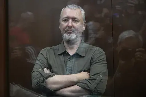 Igor Girkin also know as Igor Strelkov, the former military chief for Russia-backed separatists in eastern Ukraine sits in a glass cage in a courtroom at the Moscow's Meshchansky District Court in Moscow, Russia, Friday, July 21, 2023. A prominent Russian hard-line nationalist who accused President Vladimir Putin of weakness and indecision in Ukraine was detained Friday on charges of extremism, a signal the Kremlin has toughened its approach with hawkish critics after last month's abortive rebel
