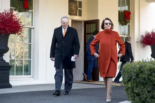 House Minority Leader Nancy Pelosi of Calif., right, and Senate Minority Leader Sen. Chuck Schumer of N.Y., left, walk out of the West Wing to speak to members of the media outside of the White House in Washington, Dec. 11, 2018, following a meeting with President Donald Trump. Pelosi's decision to step down from Democratic leadership after 20 years has many women admiring the way she wielded power. (AP Photo/Andrew Harnik, File)