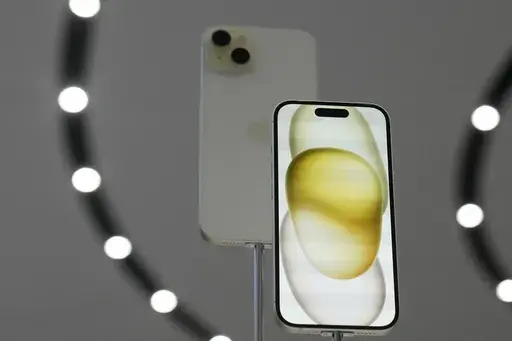 The iPhone 15 phones are shown during an announcement of new products on the Apple campus in Cupertino, Calif., Tuesday, Sept. 12, 2023. Apple on Saturday, Sept. 30, blamed a software bug some other issues tied to popular apps such as Instagram and Uber for causing its recently released iPhone 15 models to overheat and sparking complaints about being too hot to handle. (AP Photo/Jeff Chiu, File)