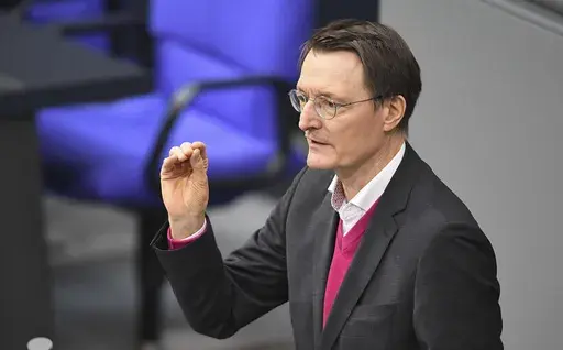 German Minister of Health Karl Lauterbach speaks during the debate on the law on the controlled release of cannabis in the plenary chamber of the German Bundestag, in Berlin, Friday Feb. 23, 2024. (Serhat Kocak/dpa via AP)