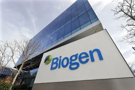 The Biogen Inc., headquarters, Wednesday, March 11, 2020, in Cambridge, Mass. Medicare says it’s considering a cut in enrollee premiums, after officials stuck with an earlier decision to sharply limit coverage for a pricey new Alzheimer’s drug projected to drive up program costs.  (AP Photo/Steven Senne, File)