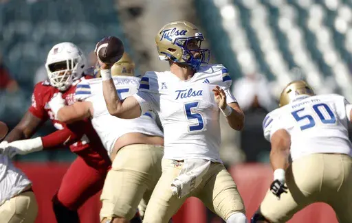 Tulsa quarterback Cooper Legas looks for an open receiver while facing Temple during an NCAA football game on Saturday, Oct. 19, 2024, in Philadelphia. (AP Photo/Jason E. Miczek, File)