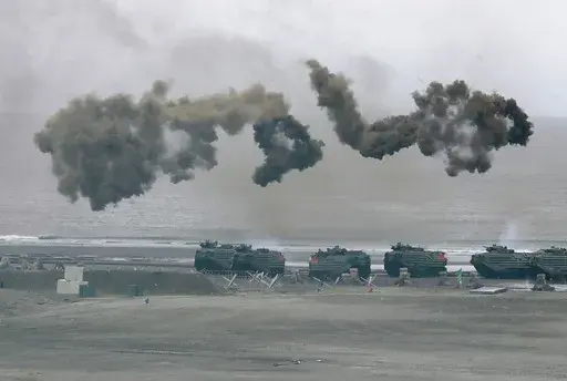 Taiwan's military holds drills of the annual Han Kuang military exercises that simulate an anti-landing operations near the coast in New Taipei City, northern Taiwan, Thursday, July 27, 2023. Taiwan military mobilized for routine defense exercises from July 24-28. The U.S. is set to announce $345 million in military aid for Taiwan, two U.S. officials said Friday. It would be the Biden administration's first major package drawing on America's own stockpiles under a new policy intended to speed up