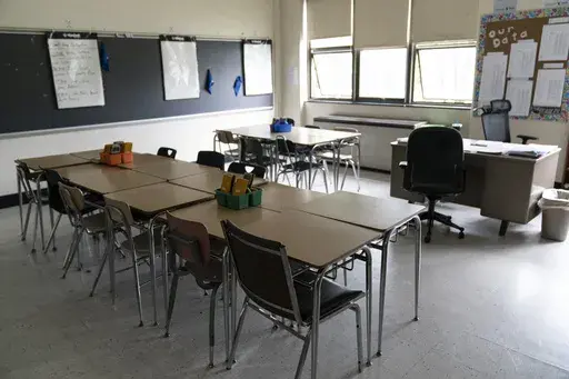 Desks fill a classroom in a high school in Pennsylvania on Wednesday, May 3, 2023. Gaps between how minority students perform academically in comparison to their white peers have long been an issue across the country. The disparities often stem from larger structural issues — a lack of access to quality curricula, for instance, or teachers expecting students to perform poorly. (AP Photo/Matt Rourke, File)