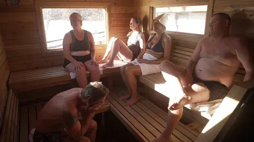 Sauna enthusiasts Jeff Tait, Emily Scribner-O’Pray, Darcy Sudderth, Miki Mosman and Igor Rudenko share a 75-minute session in a Saunable mobile sauna at Lebanon Hills Regional Park in Eagan, Minn., Sunday, Dec. 1, 2024. (AP photo/Mark Vancleave)