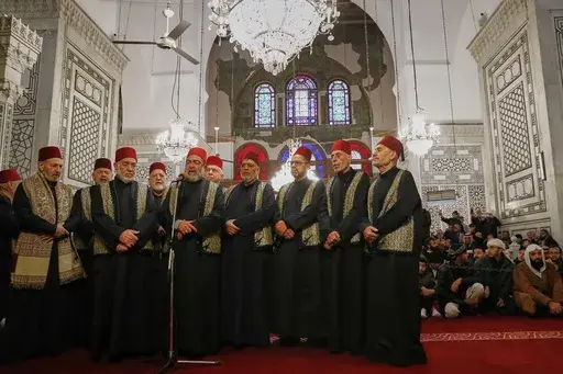 A group of sheikhs call for the prayer during the Muslim holy month of Ramadan at the Umayyad Mosque in Damascus, Syria, Friday March 7, 2025.(AP Photo/Omar Sanadiki)