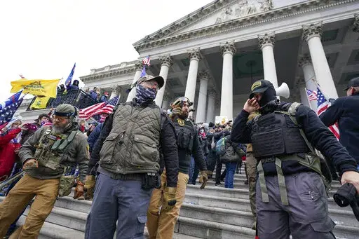 Members of the Oath Keepers stand on the East Front of the U.S. Capitol on Jan. 6, 2021, in Washington. The trial of the founder of the Oath Keepers, Stewart Rhodes, and four associates charged with seditious conspiracy in the attack on the U.S. Capitol is set to begin next week. (AP Photo/Manuel Balce Ceneta, File)