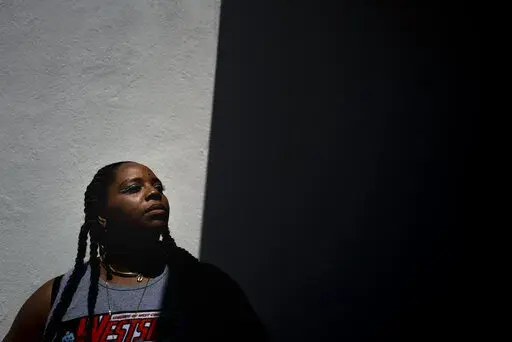 Black Lives Matter co-founder Patrisse Cullors stands for a photo at Crenshaw Dairy Mart, an art gallery and studio space co-founded by Cullors, in Inglewood, Calif., Tuesday, April 19, 2022.